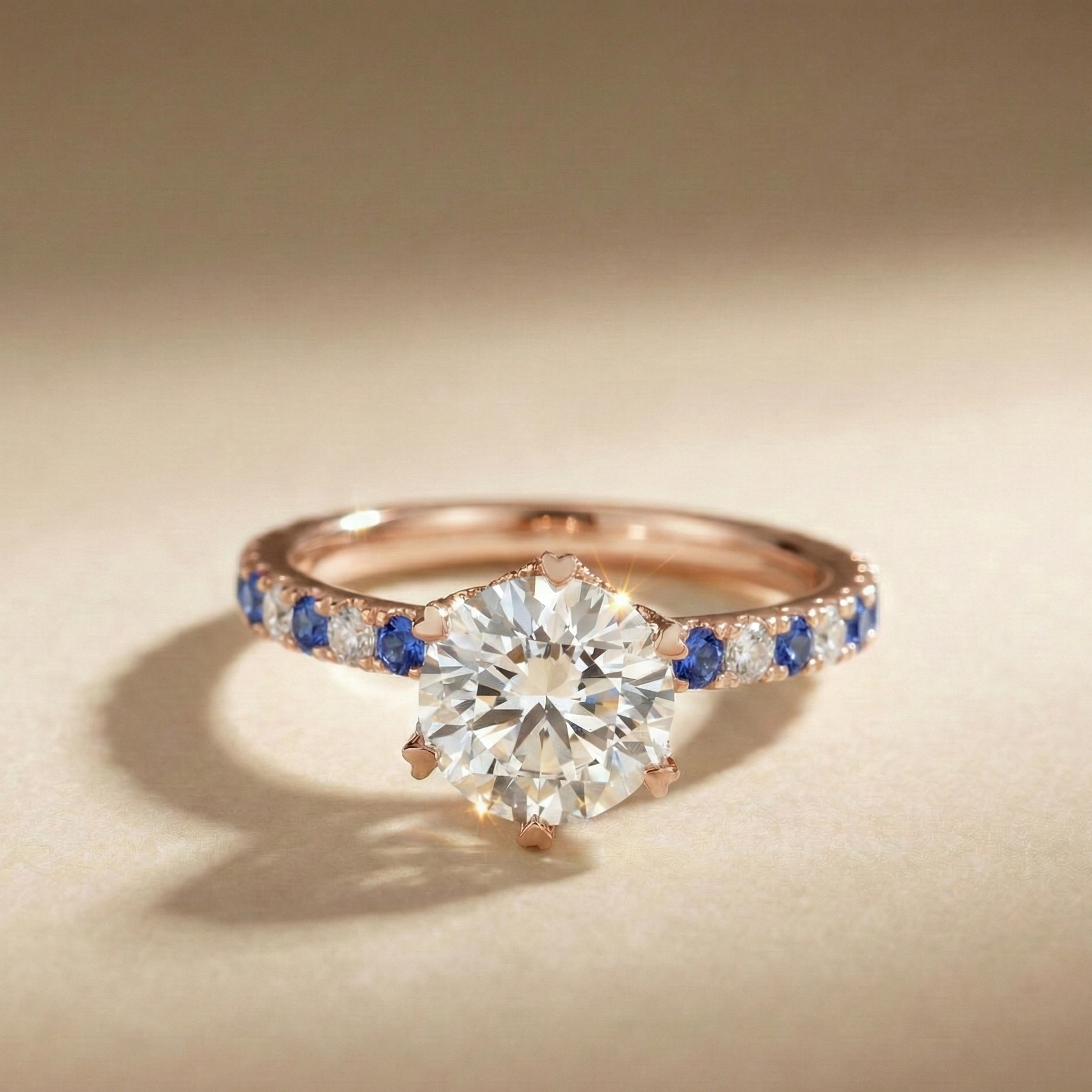 18k rose gold heart-prong sapphire pavé solitaire engagement ring | Diamond Ateliers