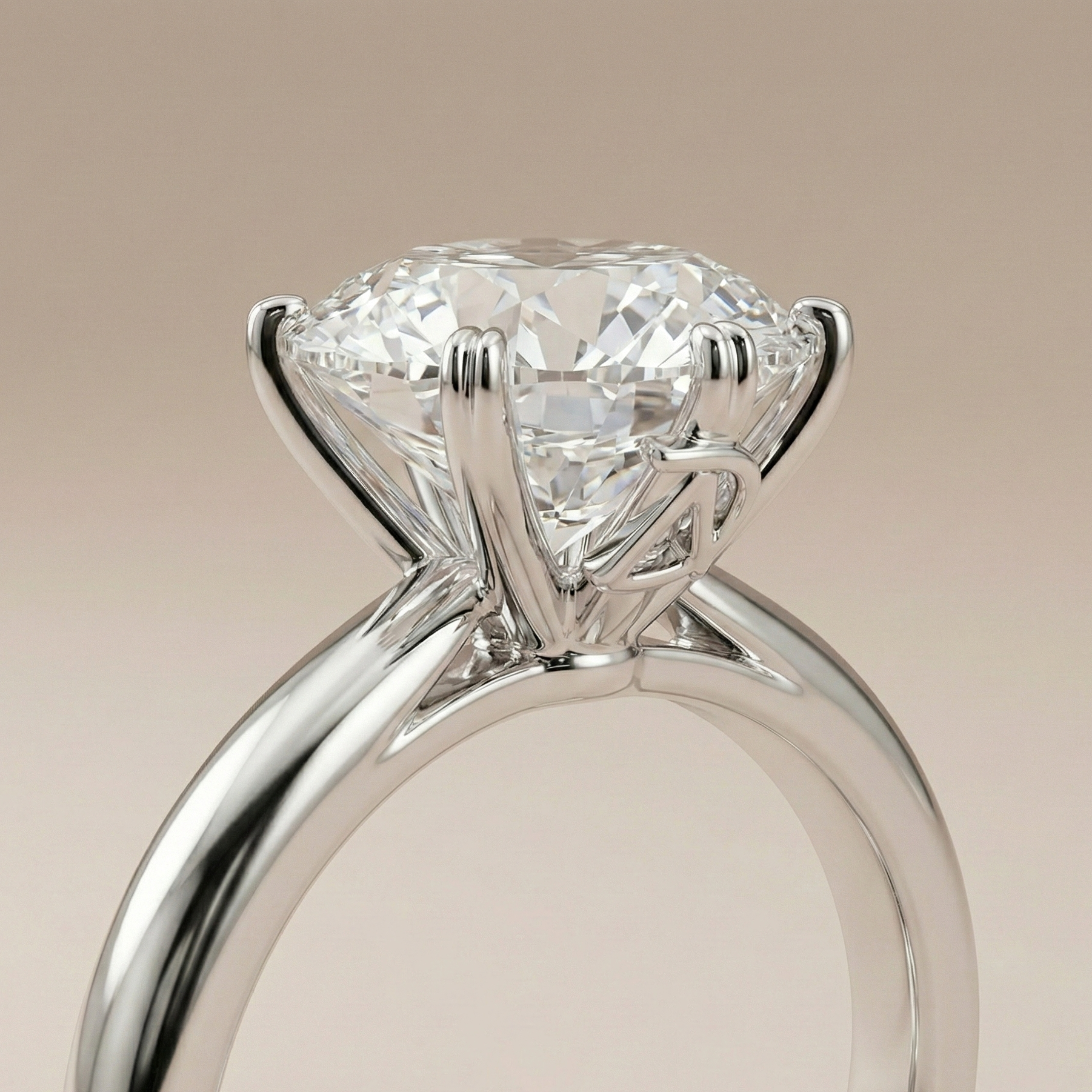 Round diamond solitaire ring on a knife-edge platinum band | Diamond Ateliers
