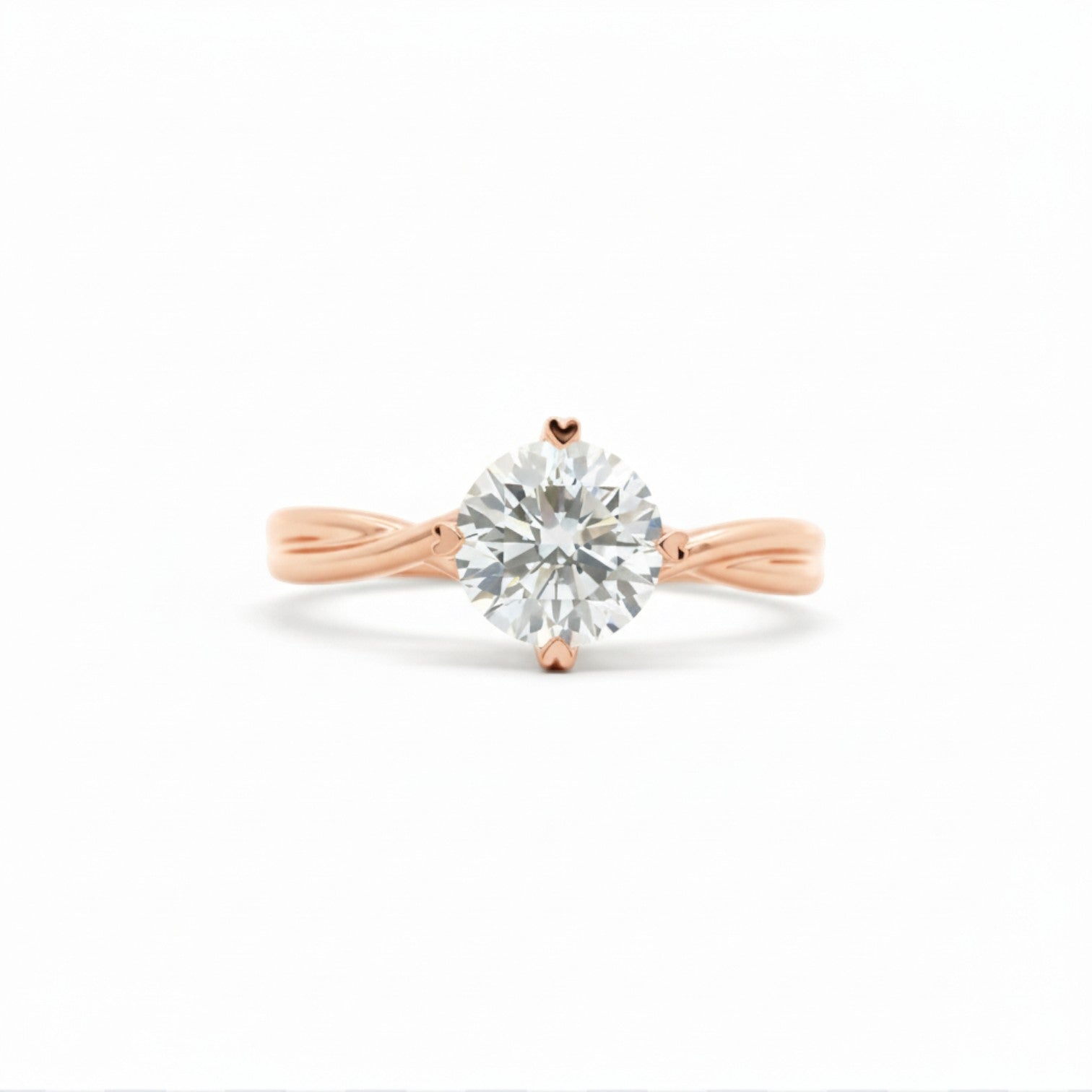 High-polish twist solitaire engagement ring with 4 heart prongs in 18K rose gold – Diamond Ateliers.