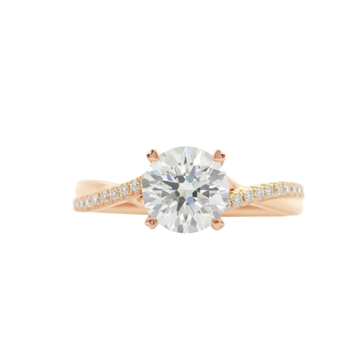 A twisted pavé band engagement ring with a round diamond and 4 claw prongs in 18K rose gold — Diamond Ateliers.