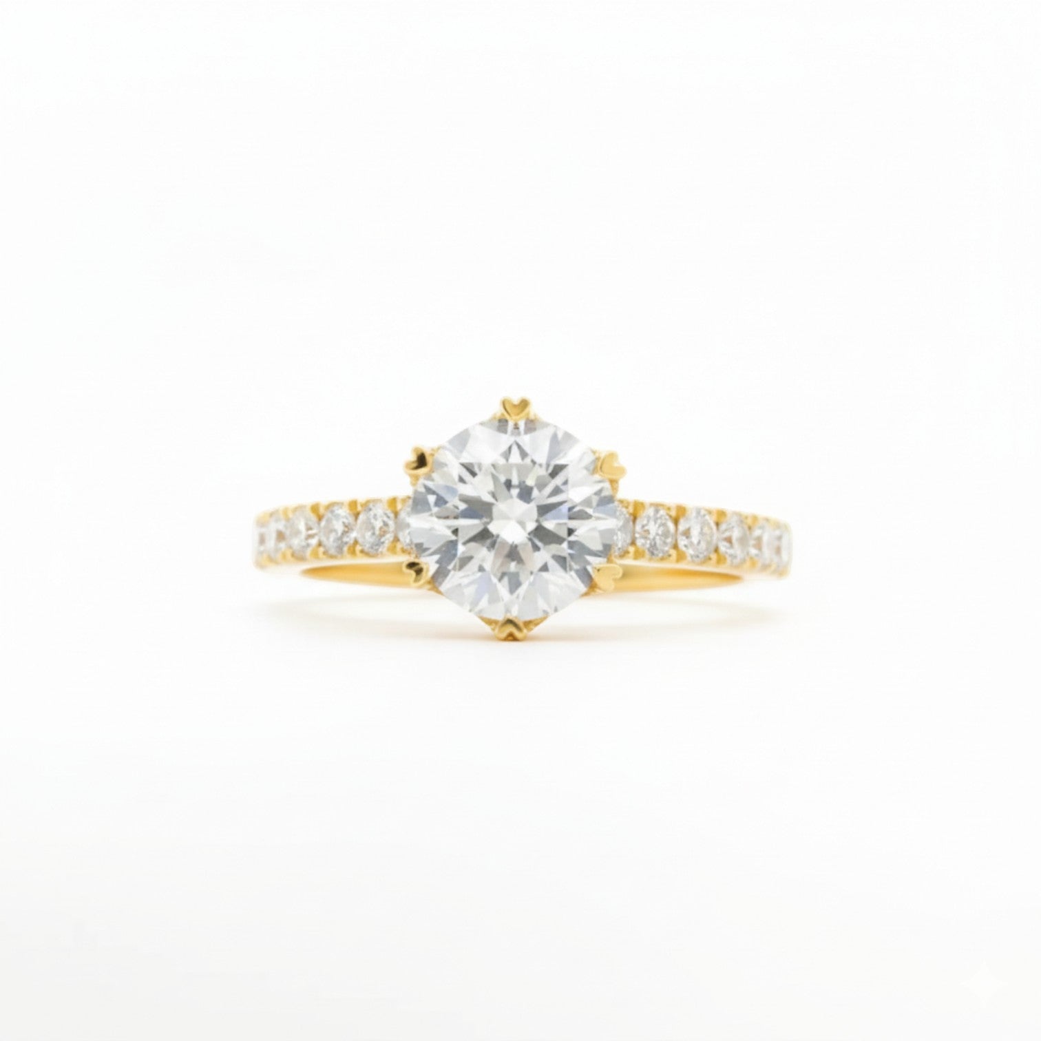 Six-heart-shaped prong pavé solitaire engagement ring in 18K yellow gold with heart-tipped prongs – Diamond Ateliers.