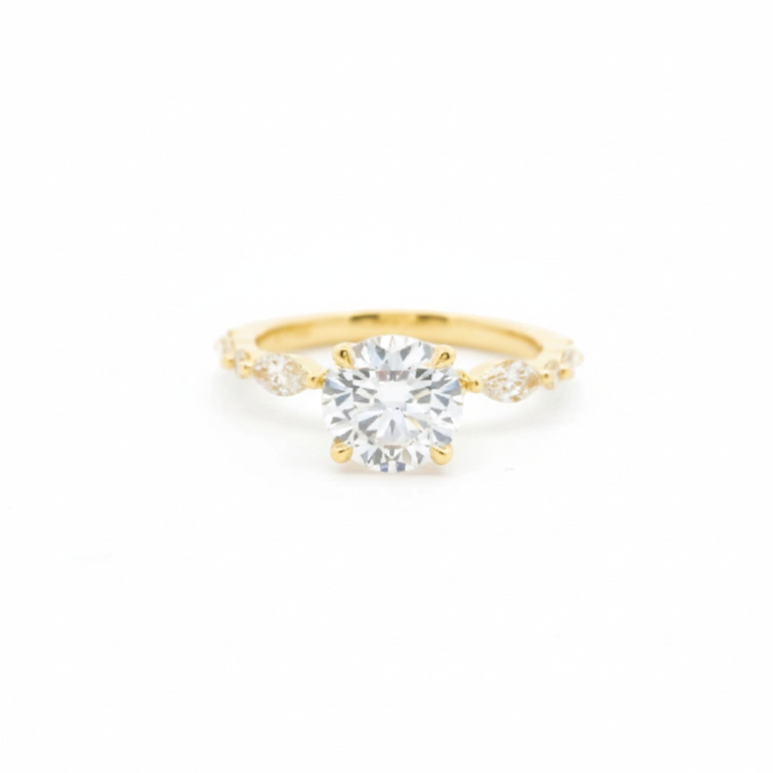 Round & marquise hybrid solitaire ring with 4 claw prongs in 18K yellow gold – Diamond Ateliers.