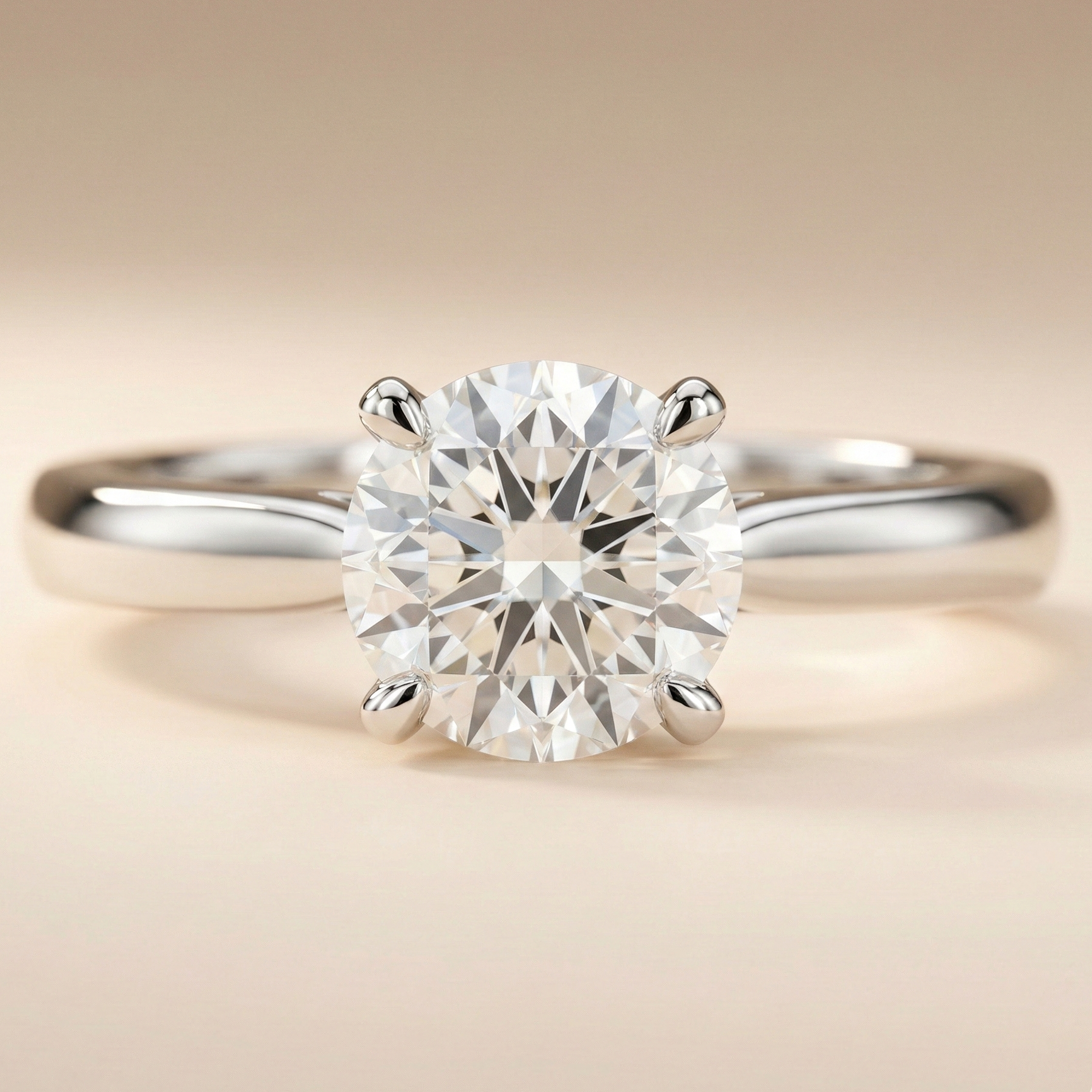 4-prong solitaire ring with a clean, minimal profile designed to maximise diamond visibility.