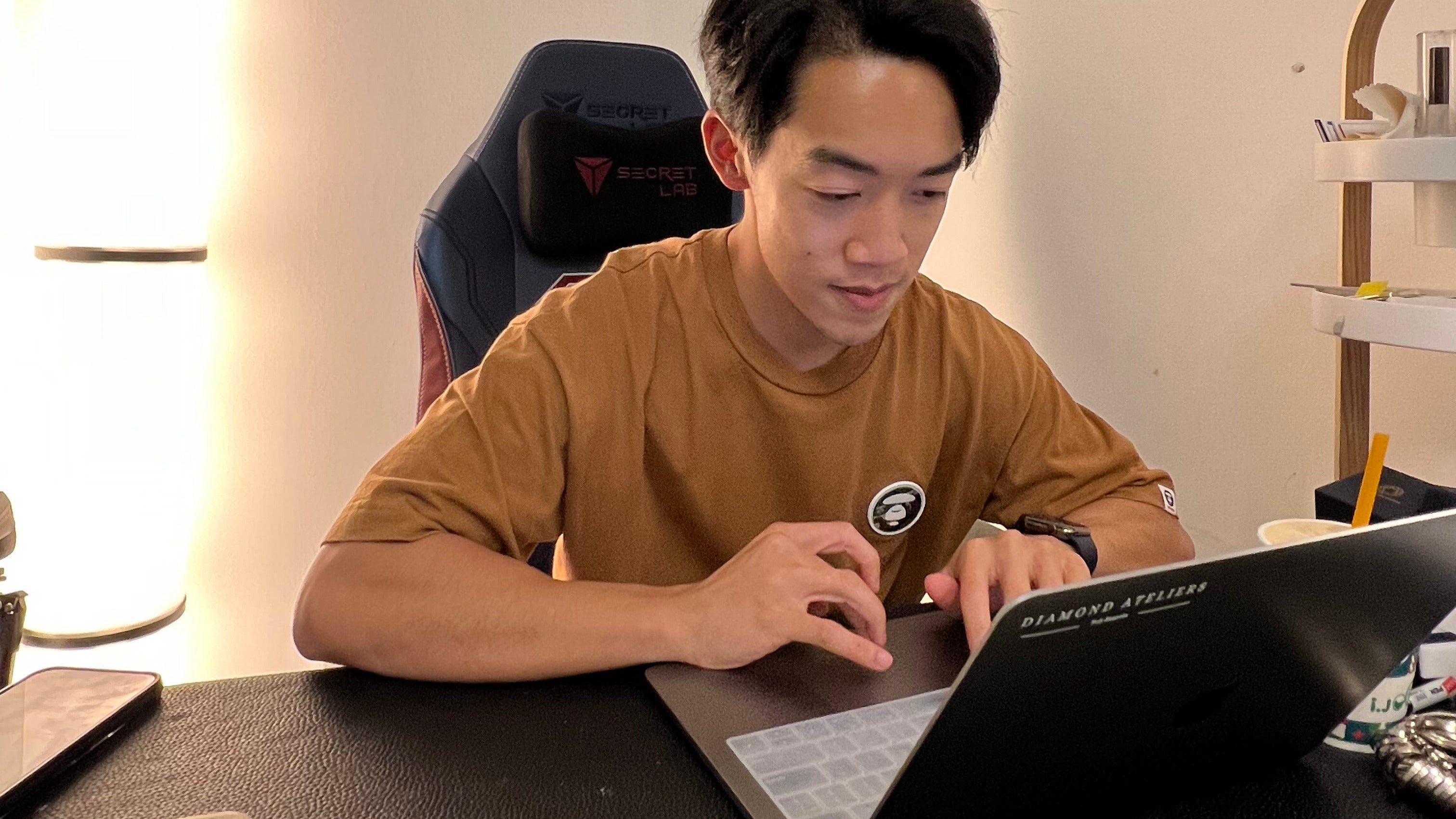 Person using a laptop at a desk -diamond ateliers