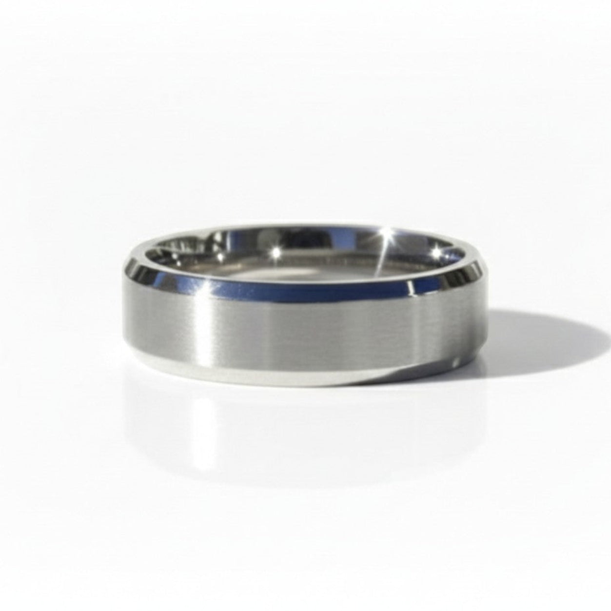 Matte finish 4mm bevel wedding band with clean edges, shown in white gold on a minimal studio backdrop.