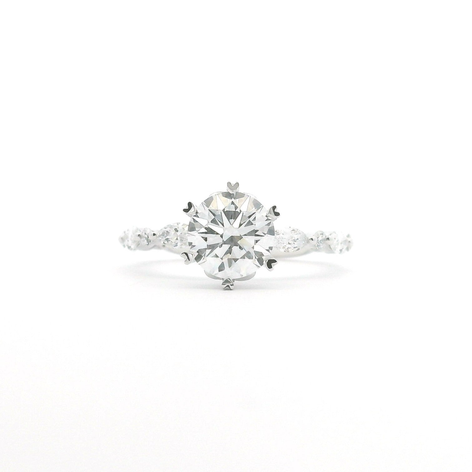 Round and marquise crown solitaire engagement ring with six heart-shaped prongs in 18K white gold – Diamond Ateliers.