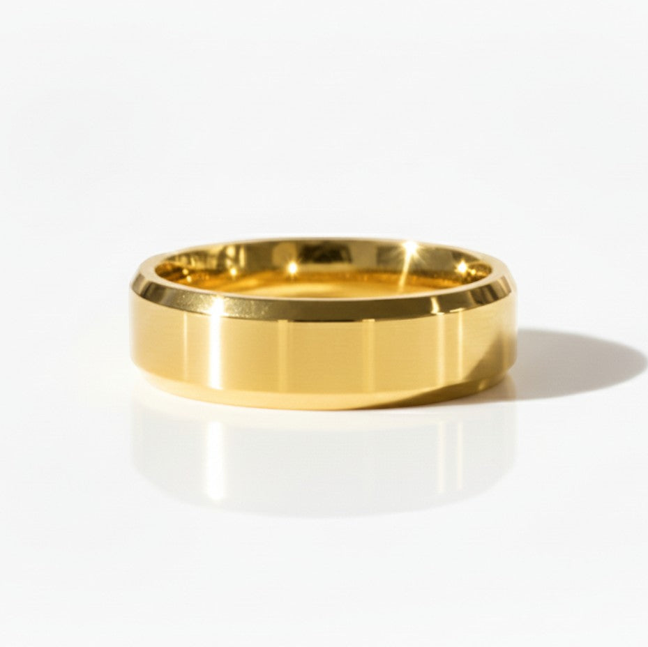 4mm glossy 18K yellow gold men’s wedding band photographed in studio lighting