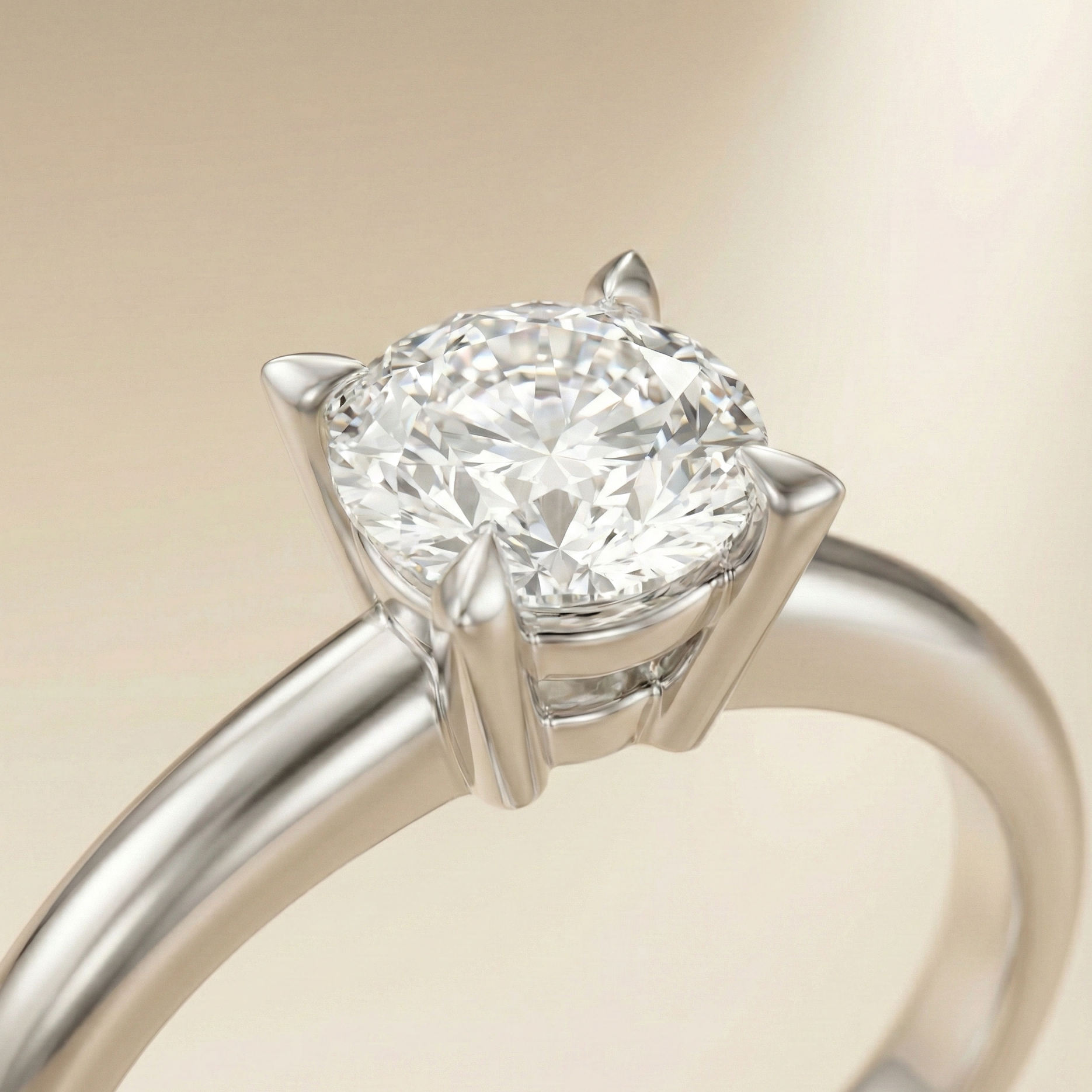Macro shot of an engagement ring featuring sharp, modern claw prongs that frame the diamond with a refined, sculpted look.