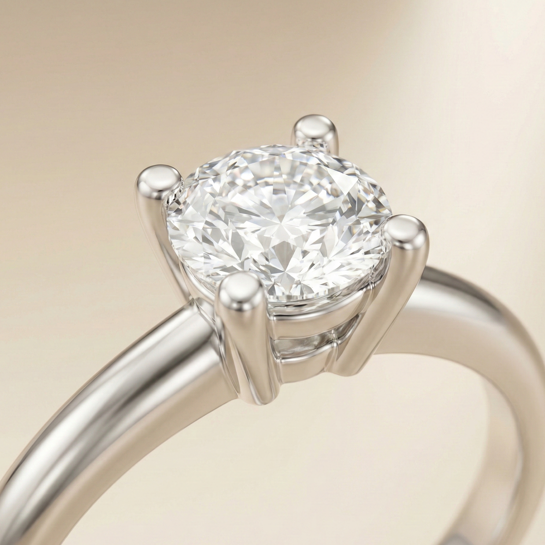 A close-up studio image of an engagement ring with smooth rounded prongs, showcasing a soft and elegant prong style.