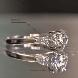 Pear-shaped diamonds on either side of a round diamond