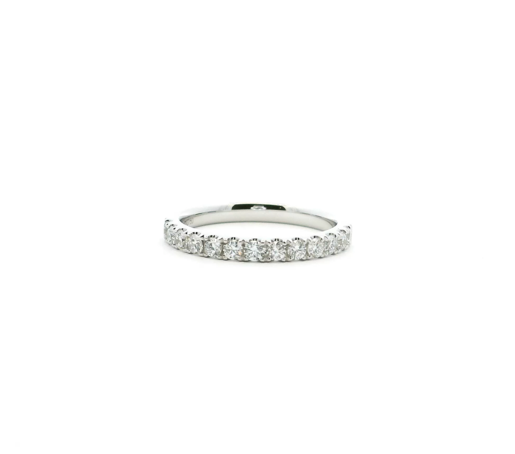 Platinum eternity ring featuring a continuous band of sparkling diamonds.