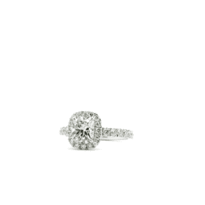 Cushion-cut halo engagement ring with 3/4 pave band in white gold.