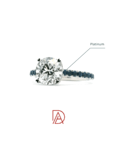 Side view of the platinum engagement ring band with blue sapphire detailing and a secure diamond setting.