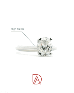 Close-up of a high-polish platinum engagement ring with an oval diamond.