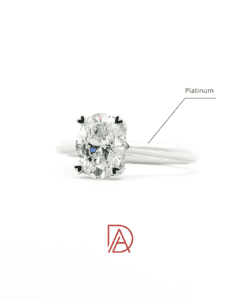 Minimalist platinum engagement ring with an oval-cut diamond and heart prongs.